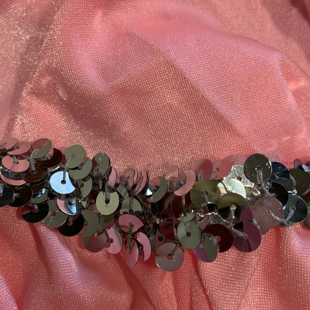 Dansco pink leotard with halter tie and trimmed in silver sequins